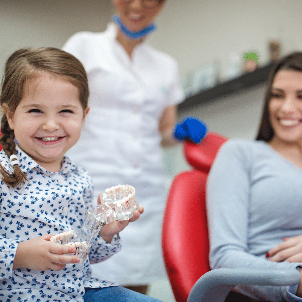 young girl smiling at dentist